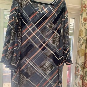 Like new blouse with open sleeves.  Flows beautifully.